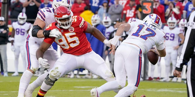 Kansas City Chiefs defensive tackle Chris Jones (95) seems to trip Buffalo Bills quarterback Josh Allen during the second half on Oct. 16, 2022, in Kansas City.