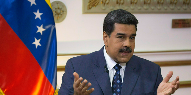 In this Feb. 14, 2019 file photo, Venezuela's President Nicolas Maduro speaks during an interview at Miraflores presidential palace in Caracas, Venezuela.