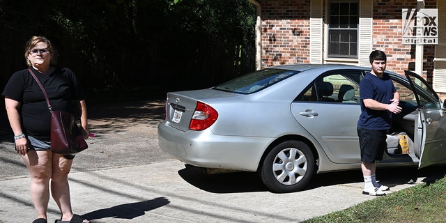 Amanda Bearden and her boyfriend, Andrew Tyler Giegerich are seen outside of their residence in Atlanta, Georgia on Friday, September 23, 2022. Bearden's mother, Debbie Collier was the victim of a brutal murder, her body found on September 11, 2022. 