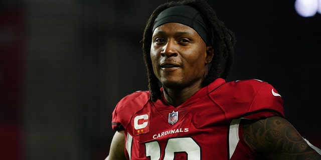 DeAndre Hopkins of the Arizona Cardinals warms up against the Los Angeles Rams prior to a game at State Farm Stadium Dec. 13, 2021, in Glendale, Ariz.