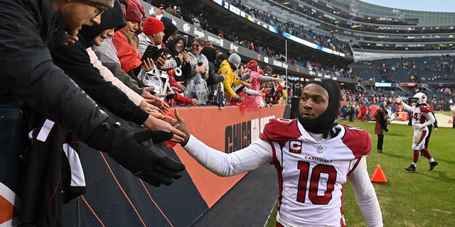 DeAndre Hopkins, #10 of the Arizona Cardinals, celebrates with fans after Arizona defeated the Chicago Bears 33-22 at Soldier Field on Dec. 5, 2021 in Chicago.