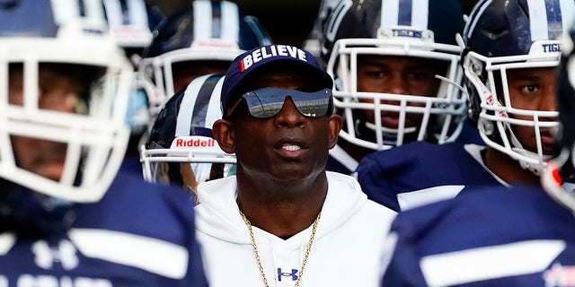 Jackson State Tigers head coach Deion Sanders enters the field with his team for the Florida A and M Rattlers game at Hard Rock Stadium.