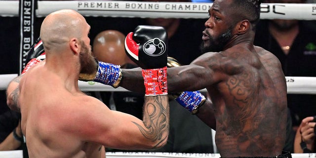 US boxer Deontay Wilder (R) fights Swedish-Finnish boxer Robert Helenius during their 12-round WBC World Heavyweight Title Eliminator fight at Barclays Center in Brooklyn, New York, on October 15, 2022.