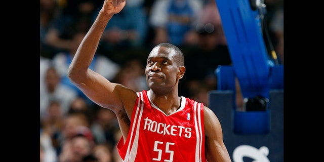 Houston Rockets center Dikembe Mutombo gestures while facing the Denver Nuggets in the first quarter of a game in Denver in 2008.