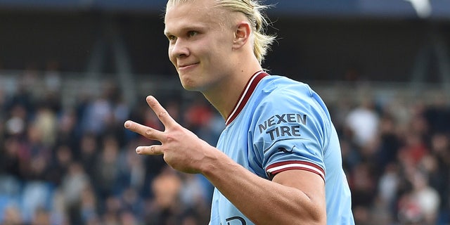 Manchester City's Erling Haaland celebrates after scoring his side's fifth goal and his personal hat trick during the English Premier League soccer match between Manchester City and Manchester United at Etihad stadium in Manchester, England, Sunday, Oct. 2, 2022. 