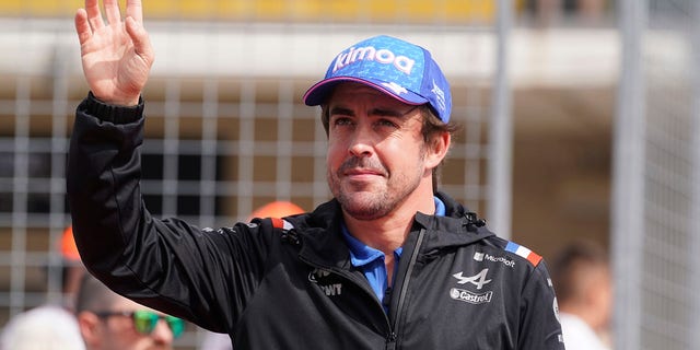 Alpine driver Fernando Alonso, of Spain, is introduced before the Formula One U.S. Grand Prix auto race at the Circuit of the Americas, Sunday, Oct. 23, 2022, in Austin, Texas. 