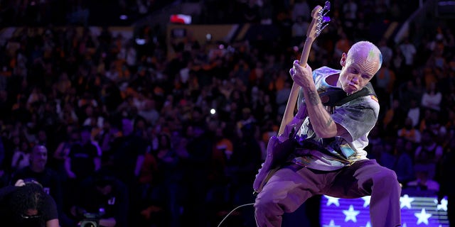 Bass player Flea of the Red Hot Chili Peppers plays the national anthem prior to a game between the Los Angeles Lakers and the Denver Nuggets at Crypto.com Arena April 3, 2022, in Los Angeles. 