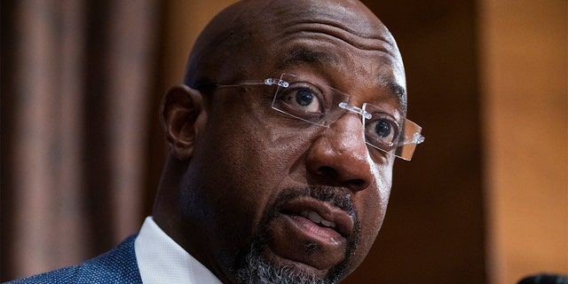 FILE - Sen. Raphael Warnock, D-Ga., questions Treasury Secretary Janet Yellen as she testifies before the Senate Banking, Housing, and Urban Affairs Committee hearing, May 10, 2022, on Capitol Hill in Washington.