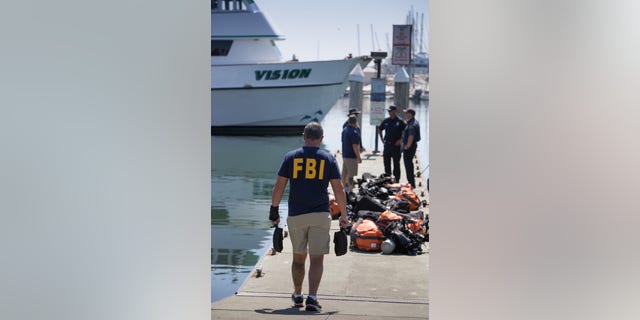 Members of the FBI's Underwater Search and Evidence Response Team prepare to recover the final body from the dive boat Conception on Sept. 5, 2019, in Santa Barbara, California.