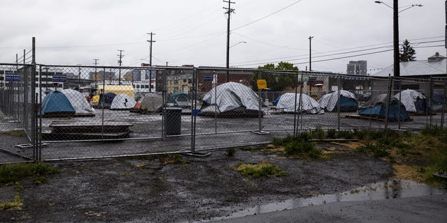 Tents sit at a camp set up for people experiencing homelessness in Southeast Portland, Oregon, U.S., on Wednesday, April 22, 2020. 