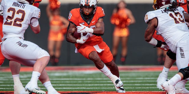 Oklahoma State Cowboys running back Dominic Richardson (20) looks for an opening during a game against the Central Michigan Chippewas Sept. 1, 2022, at Boone Pickens Stadium in Stillwater, Okla. 