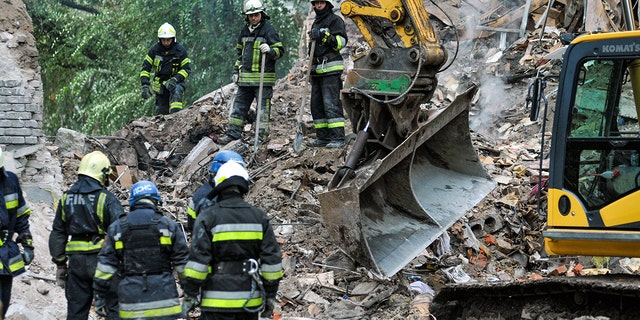 ZAPORIZHZHIA, UKRAINE - OCTOBER 11, 2022 - Rescuers eliminate the consequences of a missile attack by the russian troops, Zaporizhzhia, southeastern Ukraine.