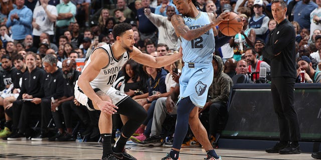 Ben Simmons plays defense on Ja Morant of the Grizzlies on Oct. 24, 2022, in Memphis.