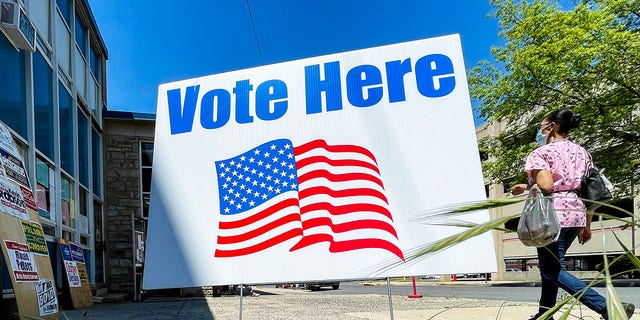 A "Vote Here" sign outside a polling place in Reading, Pennsylvania, on May 18, 2021.