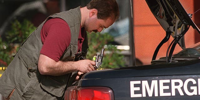 Police investigate after an attempted armored car robbery outside a Safeway on March 1, 1994.