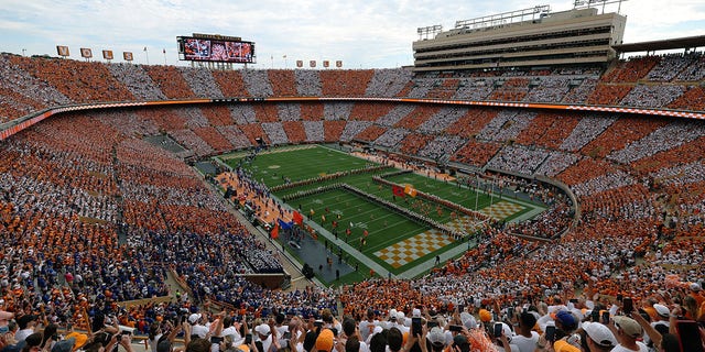 The Tennessee Volunteers team running through the 'T' before the game against the Florida Gators at Neyland Stadium on September 24, 2022, in Knoxville, Tennessee. Tennessee won the game 38-33. 