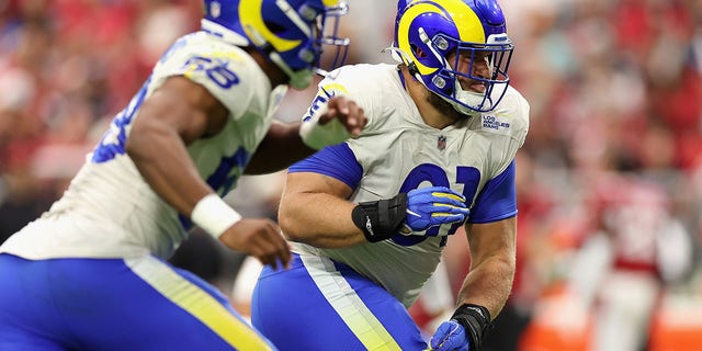 Defensive tackle Greg Gaines, right, of the Los Angeles Rams in action during the first half of the NFL game at State Farm Stadium in Glendale, Arizona, on Sept. 25, 2022.