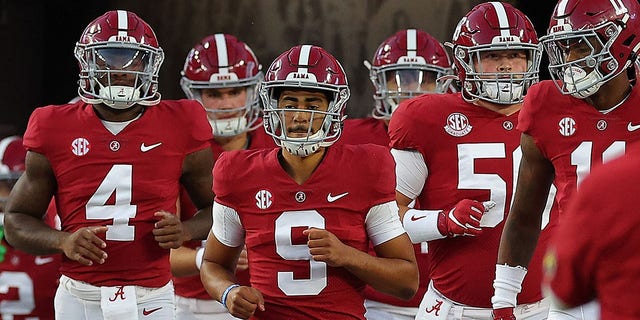 Bryce Young #9 of the Alabama Crimson Tide leads the team onto the field during pregame warmups prior to facing the Texas A&amp;amp;M Aggies at Bryant-Denny Stadium on October 8, 2022, in Tuscaloosa, Alabama. 
