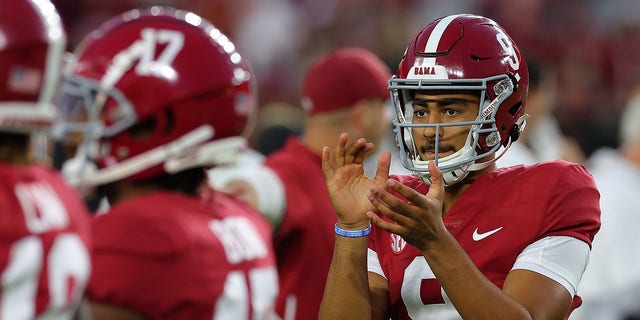 Bryce Young, #9 of the Alabama Crimson Tide, cheers on the team during pregame warmups prior to facing the Texas A&amp;M Aggies at Bryant-Denny Stadium on Oct. 8, 2022 in Tuscaloosa, Alabama. 