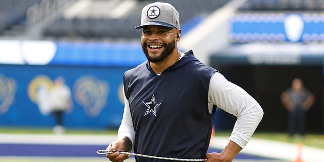 Dak Prescott of the Dallas Cowboys reacts as he warms up before a game against the Los Angeles Rams at SoFi Stadium Oct. 9, 2022, in Inglewood, Calif. 