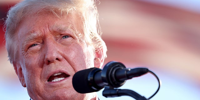 MESA, ARIZONA - OCTOBER 09:  Former U.S. President Donald Trump speaks at a campaign rally at Legacy Sports USA on October 09, 2022 in Mesa, Arizona. 