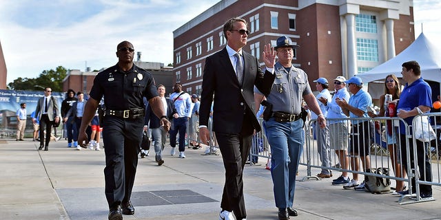 Head coach Lane Kiffin of the Mississippi Rebels arrives before the game against the Auburn Tigers at Vaught-Hemingway Stadium on October 15, 2022, in Oxford, Mississippi. 