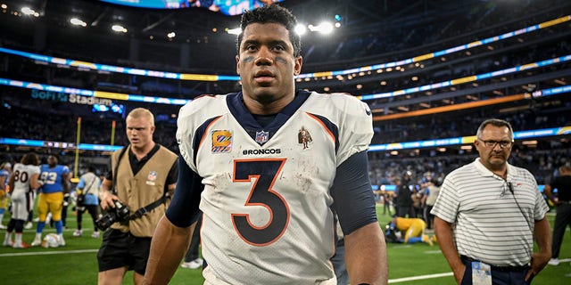 Russell Wilson (3) of the Denver Broncos walks off the field after the fourth quarter of the Los Angeles Chargers' 19-16 overtime win at SoFi Stadium in Inglewood, California, on Monday, October 17, 2022. 