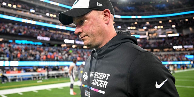 Head coach Nathaniel Hackett of the Denver Broncos walks off the field after the fourth quarter of the Los Angeles Chargers 19-16 overtime win at SoFi Stadium in Inglewood, California on Monday, Oct. 17, 2022. 