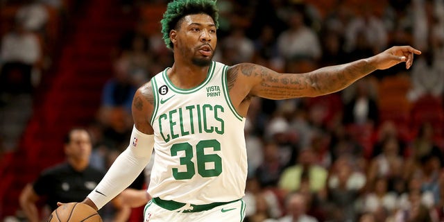 Marcus Smart #36 of the Boston Celtics dribbles down the court against the Miami Heat during the second quarter at FTX Arena on October 21, 2022, in Miami, Florida. 