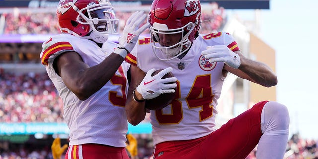 Kansas City Chiefs' Justin Watson, right, celebrates with JuJu Smith-Schuster after catching a touchdown pass against the San Francisco 49ers on Oct. 23, 2022.