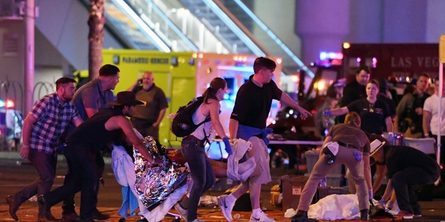 A crowd flees a shooting at the Route 91 Harvest festival shooting on Oct. 1, 2017.