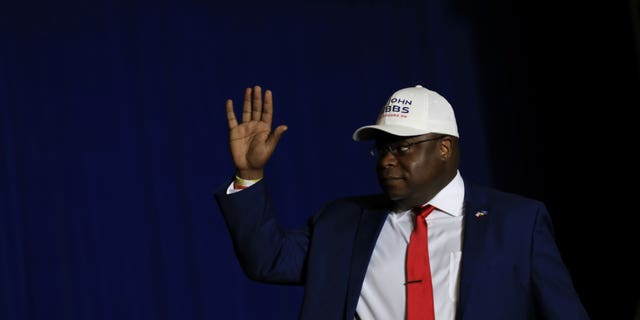 Candidate for Michigan's 3rd Congressional district John Gibbs waves to the crowd as he comes on stage during a rally held by former U.S. President Donald Trump in Washington Township, Michigan, U.S. April 2, 2022.