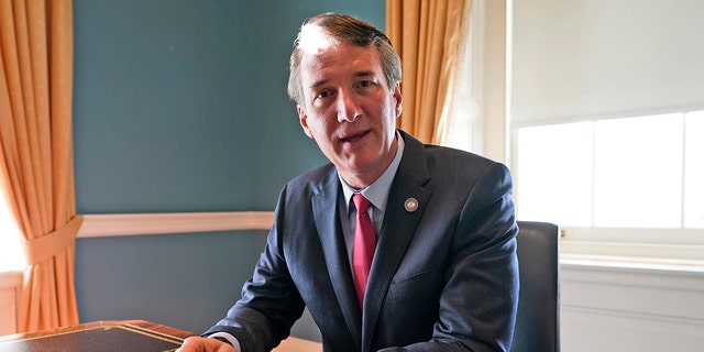 Gov. Glenn Youngkin works in the state Capitol, March 2, 2022, in Richmond.