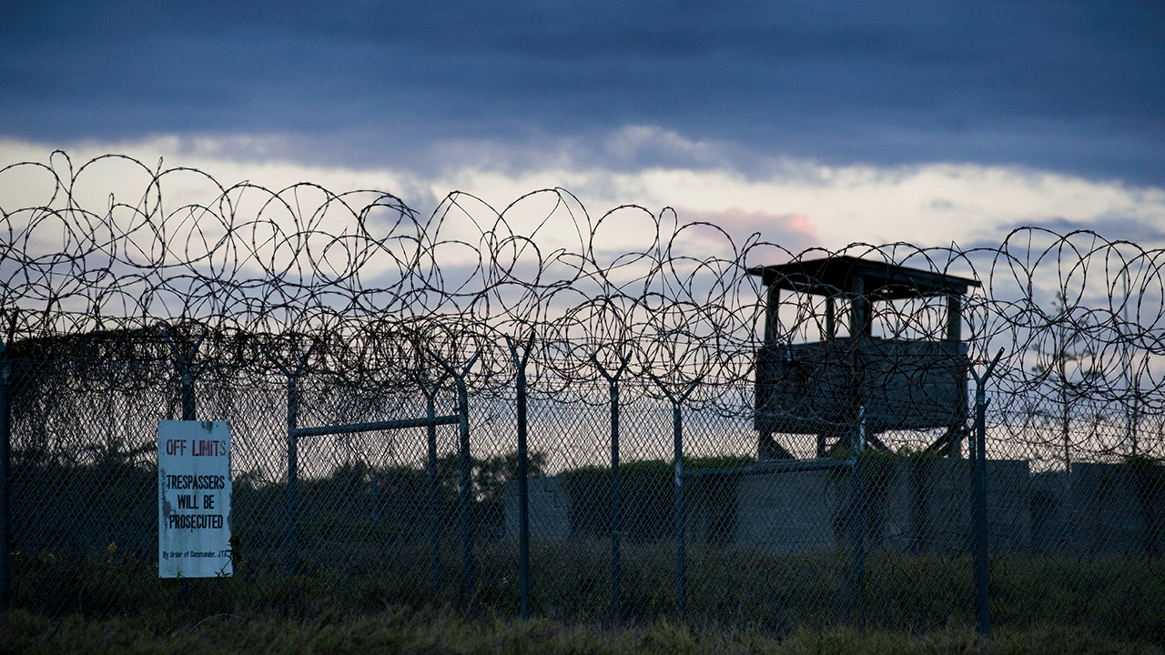 FILE - In this photo reviewed by U.S. military officials, the sun sets behind the closed Camp X-Ray detention facility, on April 17, 2019, in Guantanamo Bay Naval Base, Cuba.