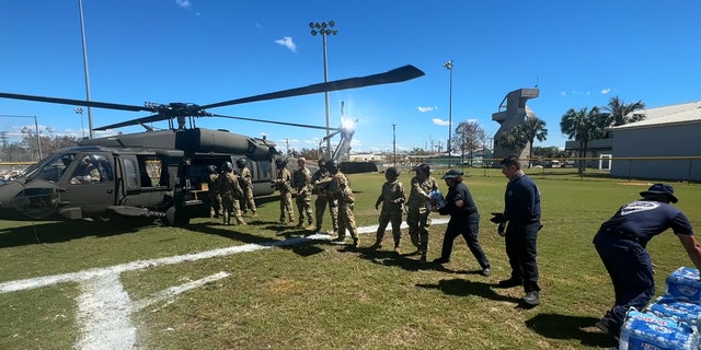 The guard dropped off water and food to Pine Island.