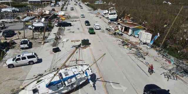 Displaced boats rest lie strewn along the San Carlos Boulevard, one day of the passage of Hurricane Ian, in Fort Myers Beach, Fla., Thursday, Sept. 29, 2022. 