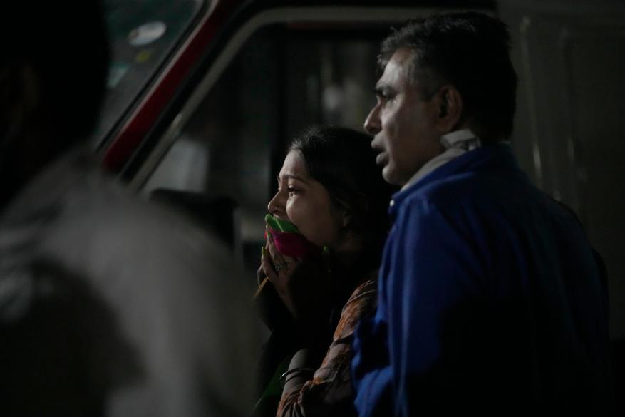 Relatives of a victim mourn after the cable bridge across the Machchu river collapsed in Morbi town of western state Gujarat, India on Oct. 31, 2022.