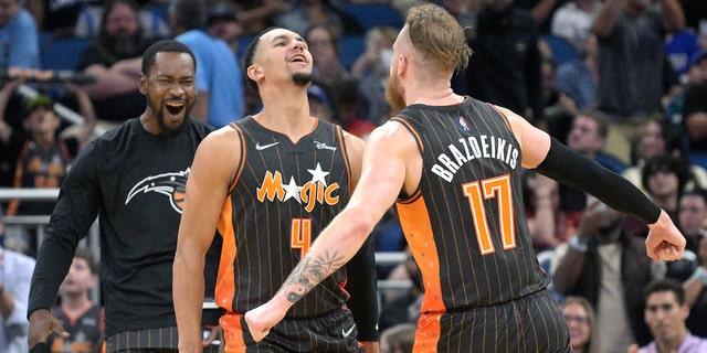 Orlando Magic forward Ignas Brazdeikis (17) celebrates with guard Jalen Suggs (4) during the second half against the Cleveland Cavaliers on April 5, 2022, in Orlando, Florida.