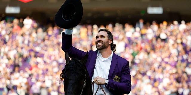 Jared Allen waves during his induction into the Vikings' Ring of Honor at U.S. Bank Stadium on Oct. 30, 2022, in Minneapolis, Minnesota.