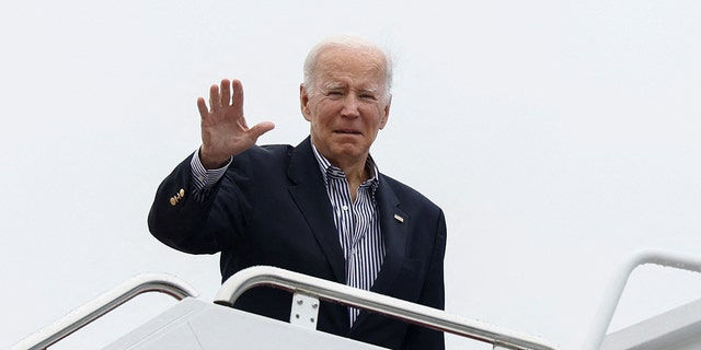 President Biden waves as he boards Air Force One upon departure for Florida from Joint Base Andrews in Maryland, Oct. 5, 2022.