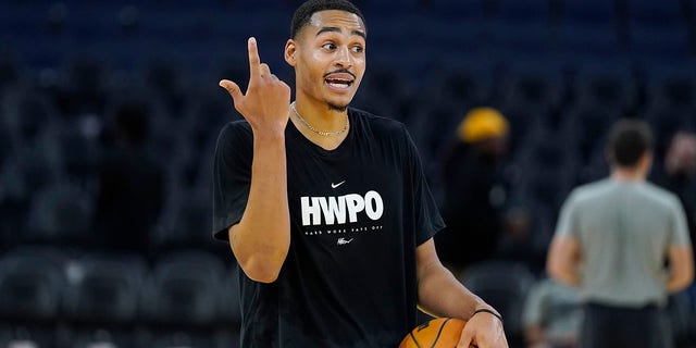 Golden State Warriors guard Jordan Poole warms up before a preseason game against the Denver Nuggets in San Francisco on Oct. 14, 2022.