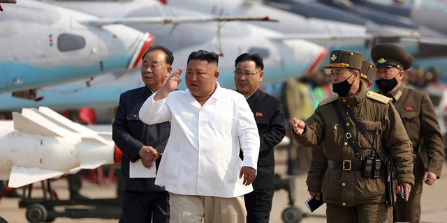 In this undated file photo provided by the North Korean government on April 12, 2020, North Korean leader Kim Jong Un inspects an air defense unit in western area, North Korea. The North on Thursday, Dec. 30, 2021, urged its 1.2 million troops to unite behind leader Kim and defend him with their lives, as the country celebrated the 10th anniversary of his ascension to supreme commander of the military. 