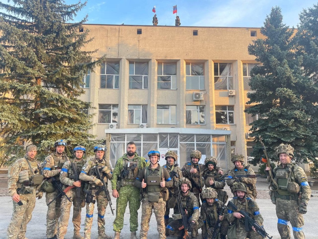 Ukrainian armed forces make a statement in front of Lyman Town Administration office, in Lyman, Ukraine on Oct. 1, 2022.