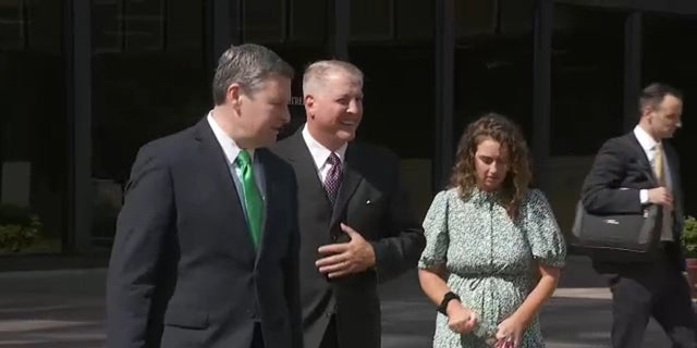 Pro-life activist Mark Houck, second from left, leaves federal court in Philadelphia after pleading not guilty to two counts associated with an alleged attack on an escort outside an abortion clinic in 2021.