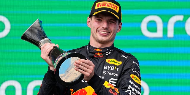 Red Bull driver Max Verstappen, of the Netherlands, raises the trophy after winning the Formula One U.S. Grand Prix auto race at Circuit of the Americas, Sunday, Oct. 23, 2022, in Austin, Texas. 