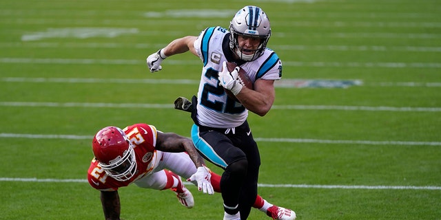 Carolina Panthers running back Christian McCaffrey runs past Kansas City Chiefs cornerback Bashaud Breeland during the second half of their game in Kansas City, Missouri, on Nov. 8, 2020.