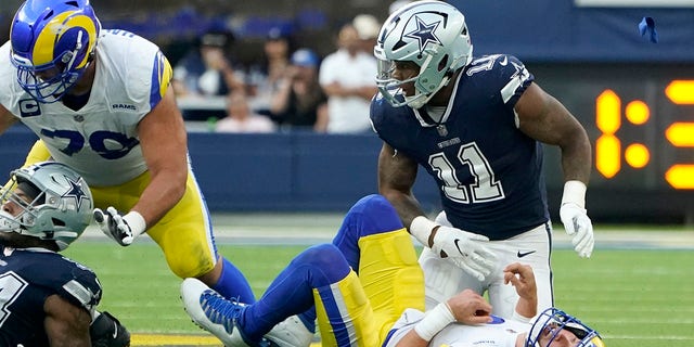 Los Angeles Rams quarterback Matthew Stafford loses the ball after being sacked by Dallas Cowboys linebacker Micah Parsons, Sunday, Oct. 9, 2022, in Inglewood, California.