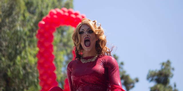 A drag queen sings during the annual Gay Pride Parade in Tel Aviv, Israel, Friday, June 12, 2015. 