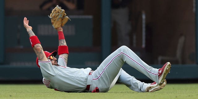 Nick Castellanos of the Philadelphia Phillies makes a catch on William Contreras of the Atlanta Braves during the ninth inning in Game 1 of the National League Division Series at Truist Park Oct. 11, 2022, in Atlanta.