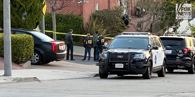 FBI investigators are seen outside the home of Nancy and Paul Pelosi where Paul was the victim of a violent home invasion, Friday October 28, 2022.